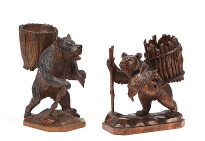 null Two walking bears in carved and patinated wood, leaning on a stick and carrying...
