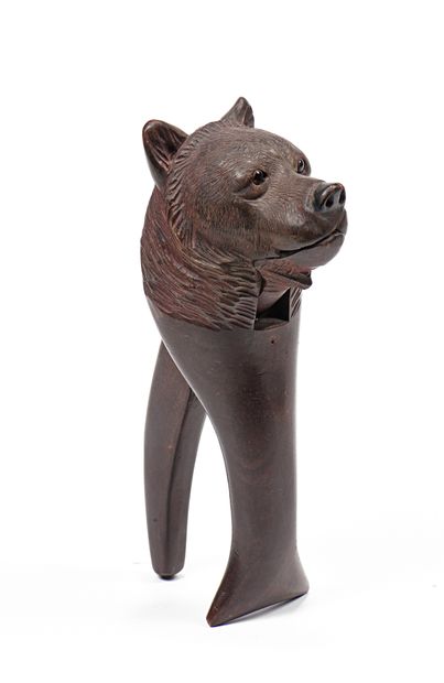 null Carved and patinated mahogany nutcracker with bear decoration Early 20th century...