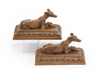 null Two statuettes in patinated plaster decorated with recumbent greyhounds on a...