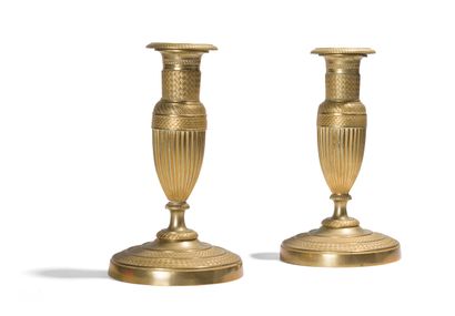 Two pairs of chased ormolu torches with geometrical...
