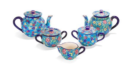 LONGWY
Two polychrome enamel tea sets decorated...