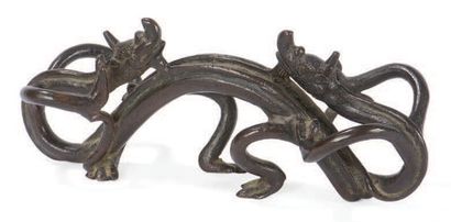 null Repose pinceau en bronze patiné brun
À décor de deux dragons entrelacés.
Chine...