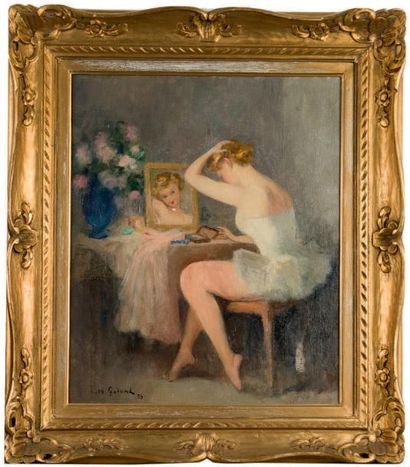 Léon GALAND (1872-1960) 
Ballerine devant sa coiffeuse.
Huile sur toile.
Signé et...