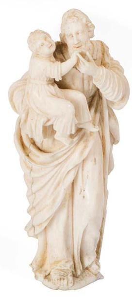 ECOLE FRANCAISE XIXeme SIECLE † Saint Christophe.
Statuette d'applique en ivoire...