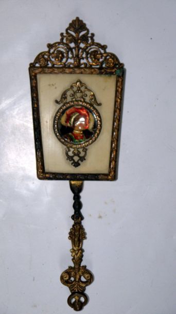 null Small hand mirror in gilt bronze. On one side an ivory plate, inlaid in hollow...