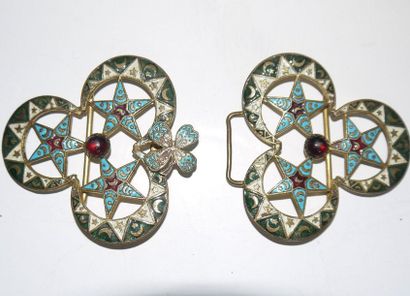 null Enamelled bronze belt buckle, inlaid with stones forming three crescents and...
