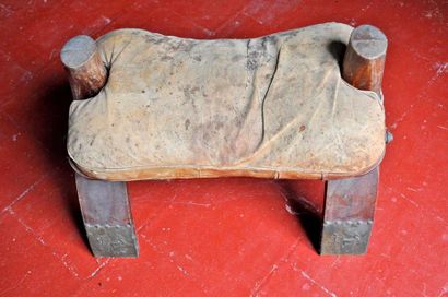 null Camel saddle in wood and engraved leather. North Africa around 1930