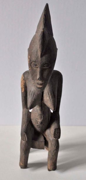 Statuette in carved wood, sitting form. SENOUFO....
