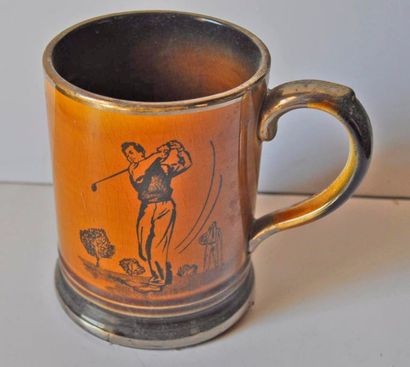 Enamelled stoneware mug (golfer) England...