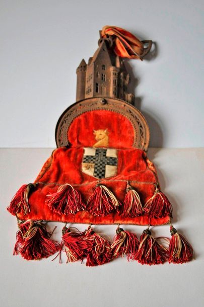 null Velvet gibernas embroidered with a coat of arms, metal clasp about the castle....