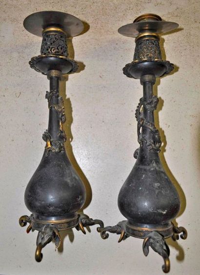 null 2 candlesticks in gilt bronze with patina about elephants and dragons in the...