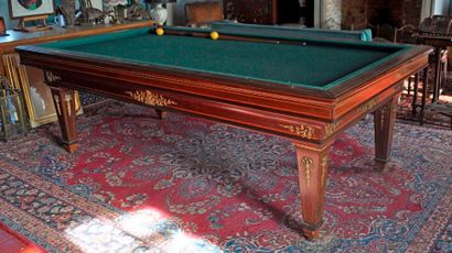 null E. BRIOTET in Paris. Rosewood billiard table inlaid with nets on tapered legs....