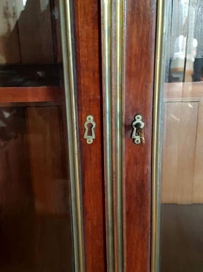 null 2-door showcase. Mahogany detached columns and brass threads. Height. 220 cm...