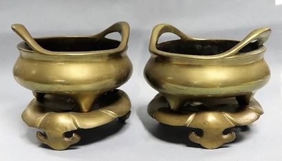 null Pair of tripod perfume burners with their bronze bases with yellow patina and...