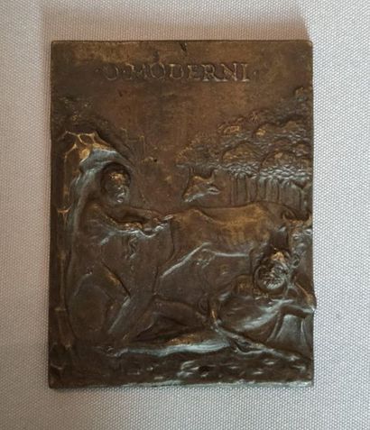 null Small bronze plaque representing two characters, one lying down and the other...