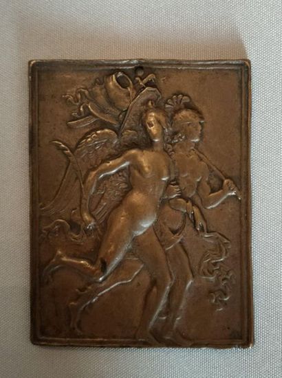 null Bronze plaque representing a winged woman and a man wearing a helmet with warrior...