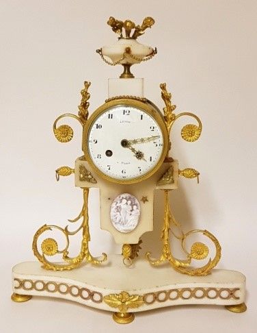 null White marble and gilt bronze clock decorated with a Wedgwood medallion. LEROY...