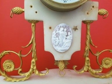 null White marble and gilt bronze clock decorated with a Wedgwood medallion. LEROY...