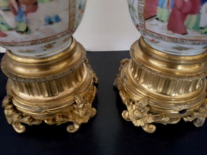 null A pair of 19th century Canton porcelain lamps with gilt bronze mountings. Height...
