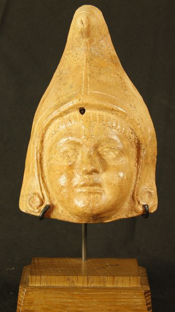 null Terracotta protome representing the god Attis wearing the Phrygian cap given...