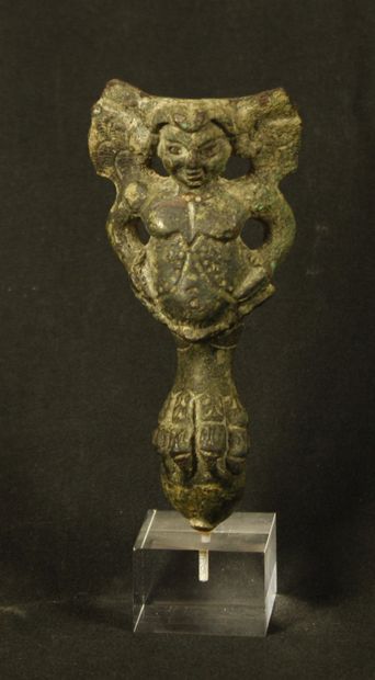 Bronze vase base formed by a lion's paw on...