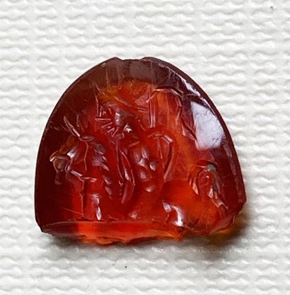 null Carnelian intaglio engraved with Helios on a horse, holding a whip on the right....