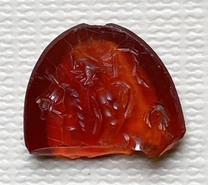 null Carnelian intaglio engraved with Helios on a horse, holding a whip on the right....