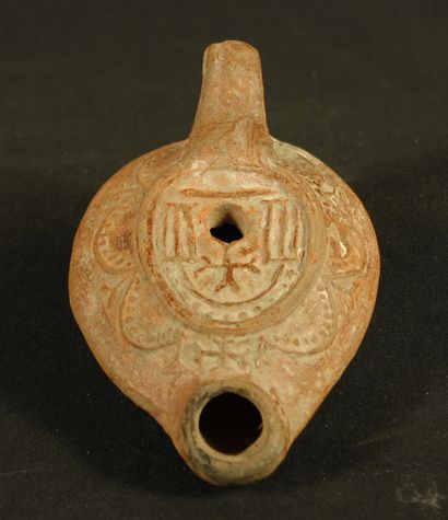 null Terracotta oil lamp decorated with geometric motifs and crosses. Byzantine period,...