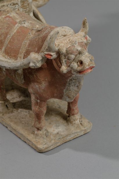 null Cart pulled by a harnessed ox, the large wheels decorated with lotiform motifs,...
