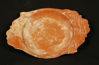 Oval dish in brick-red sigillate with two...