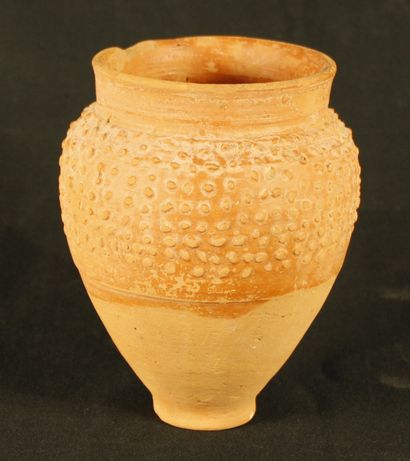 Terracotta pottery with a pear-shaped body...