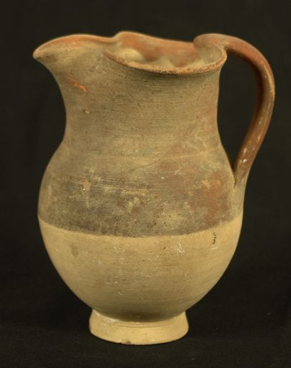 Terracotta pitcher with pinched spout, the...