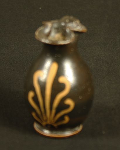 null Ceramic miniature oenochoe with trefoil beak and red figure decorated with a...