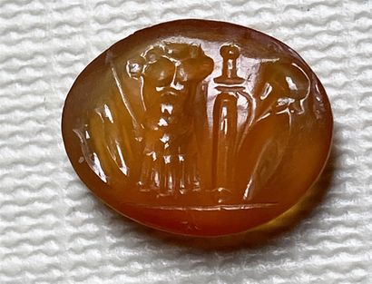 null Carnelian intaglio engraved with a panoply: cuirass, leggings, sword, shield,...