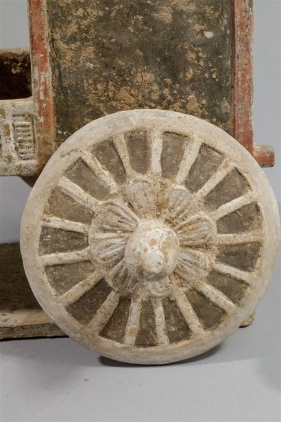 null Cart pulled by a harnessed ox, the large wheels decorated with lotiform motifs,...