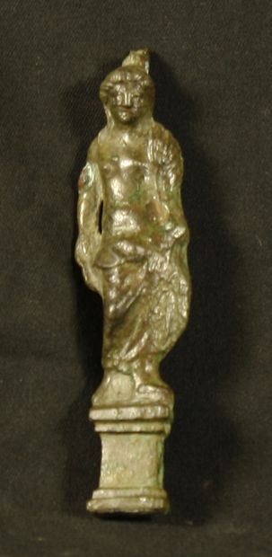 null Statuette in cast bronze representing Minerva with a drapery wrapped around...