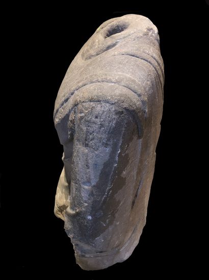 null 
Acephalous sandstone bust of Buddha revealing the pleated drape.

China, Tang...