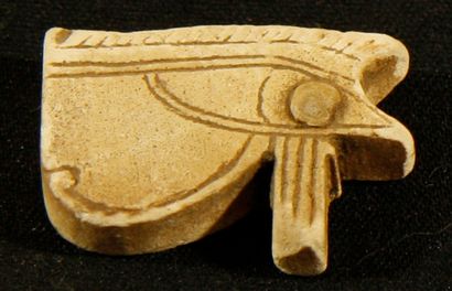 null White steatite amulet in the shape of an eye of Udjat. Egypt, XVI-XXX Dynasty...