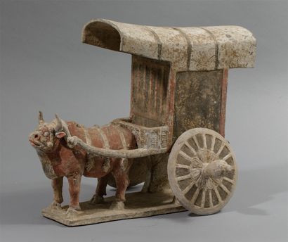 Cart pulled by a harnessed ox, the large...