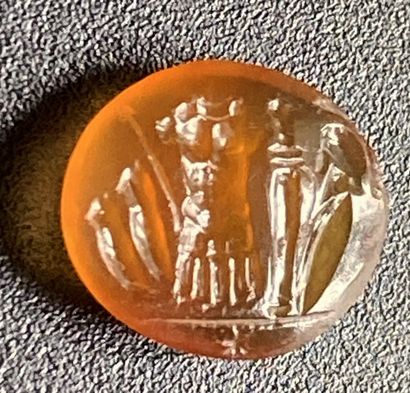 null Carnelian intaglio engraved with a panoply: cuirass, leggings, sword, shield,...