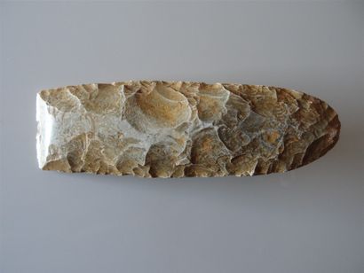 Axe or chisel carved from sandstone flint...