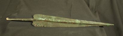 Bronze sword with bulging median stripe....