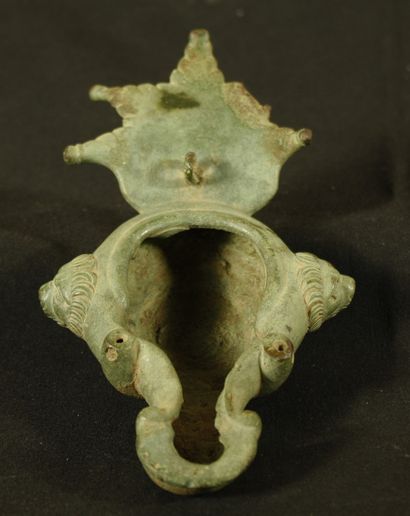 Oil lamp in bronze with triangular spout...