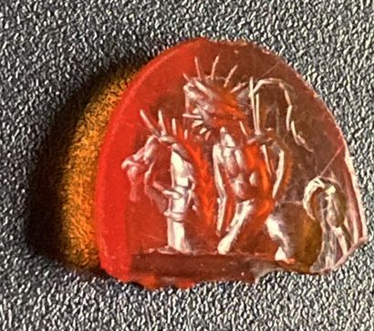 null Carnelian intaglio engraved with Helios on a horse, holding a whip on the right....