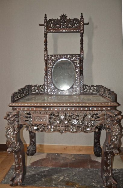 null PERRET and VIBERT. Attributed to. Ironwood dressing table carved with heads...