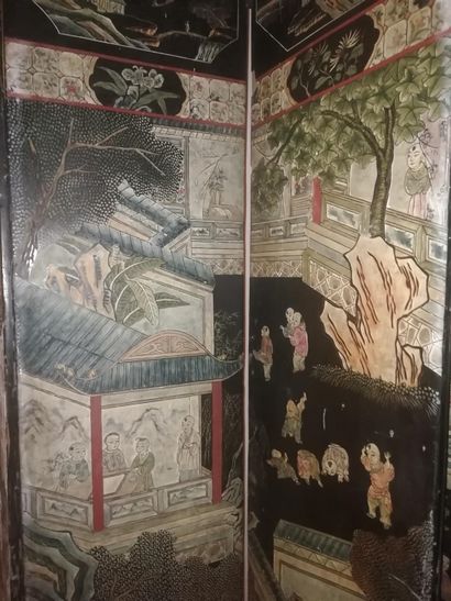 null Coromandel lacquer screen with animated scenes of Chinese characters in palaces....