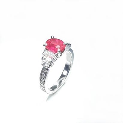  Ring in white gold palladium of 4.70 gr, decorated with an oval ruby weighing 2.05...
