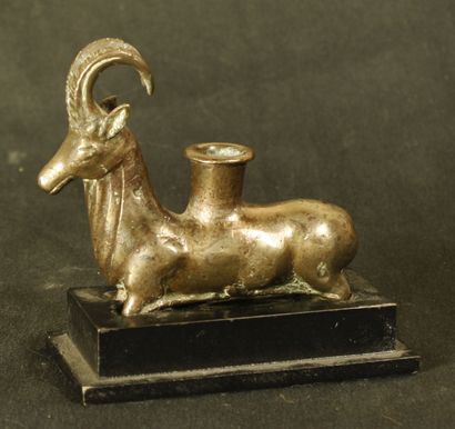 null Plastic ointment vase in the shape of an ibex in silver bronze. He is lying...