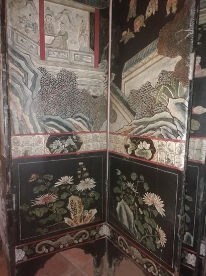 null Coromandel lacquer screen with animated scenes of Chinese characters in palaces....