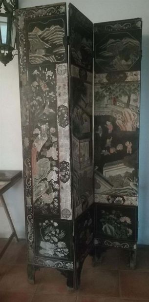 null Coromandel lacquer screen with animated scenes of Chinese characters in palaces....